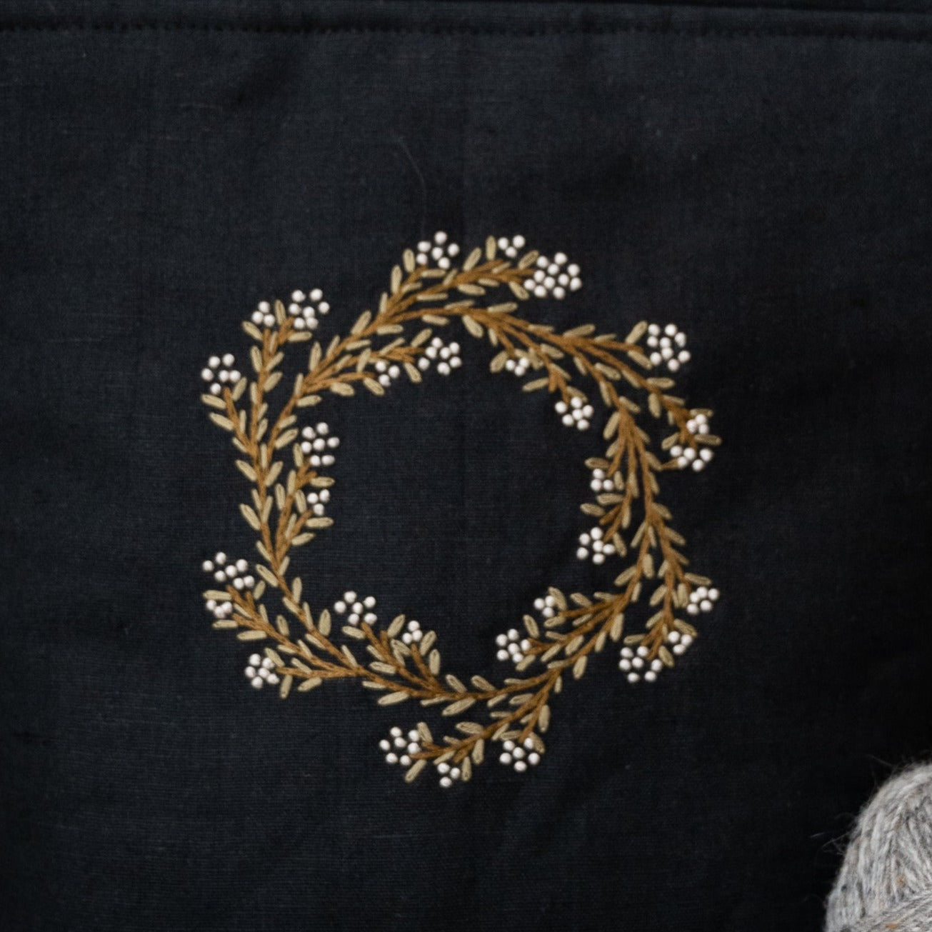 Spring wreath on black small bag